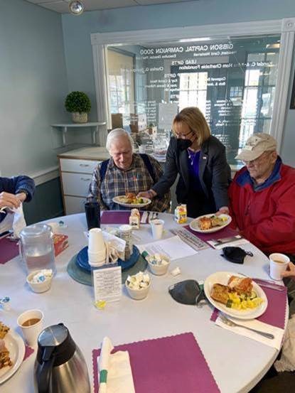 Senator Hassan serves meals at the Gibson Center